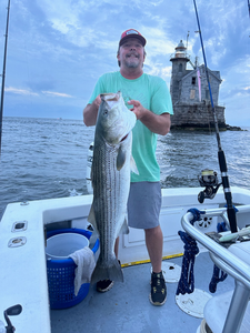 Reeling Striped Bass In Long Island NY